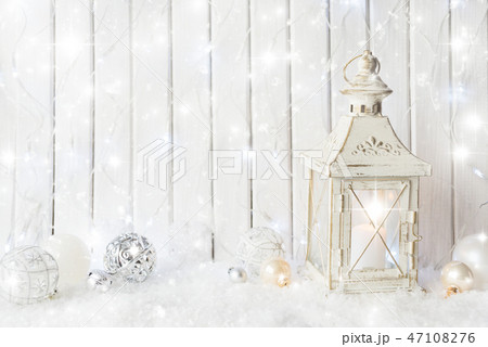 White lantern with Christmas ornaments 47108276