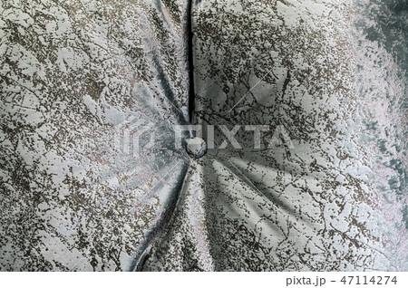 Textured background surface of textile upholstery furniture with a button close-up. gray blue Color Textured background surface of textile upholstery furniture with a button close-up. gray blue Color 47114274