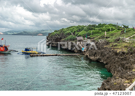 Landscape azure sea and a rocky coast Crystal Cove small island near Boracay island in the 47123007