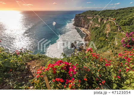 View of Uluwatu cliff with coast and blue ocean in Bali, Indonesia View of Uluwatu cliff with coast and blue ocean in Bali, Indonesia 47123054