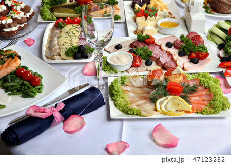 decorated table, with meat and fish specialties. 47123232