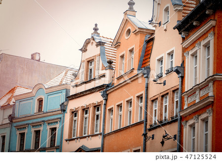 View at roofs and windows of old houses View at roofs and windows of old houses 47125524