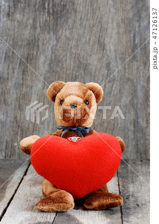 Toy bear doll and the jewelry ring with red heart. Toy bear doll and the jewelry ring with red heart. 47126137