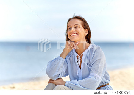happy smiling woman on summer beach happy smiling woman on summer beach 47130856
