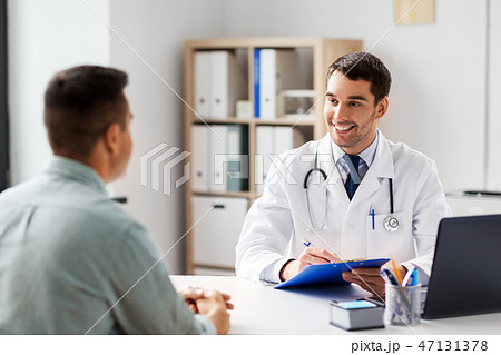 doctor with clipboard and male patient at hospital doctor with clipboard and male patient at hospital 47131378