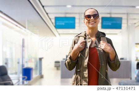 young woman with backpack over airport terminal young woman with backpack over airport terminal 47131471
