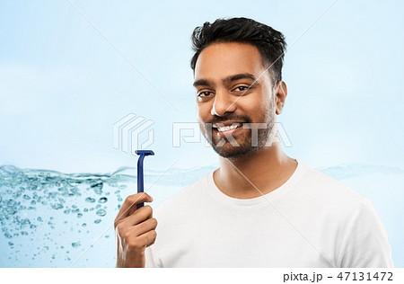 indian man shaving beard with razor blade indian man shaving beard with razor blade 47131472