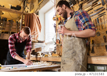 carpenters with ruler and coffee at workshop carpenters with ruler and coffee at workshop 47131583