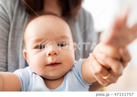 close up of asian baby boy with mother 47131757