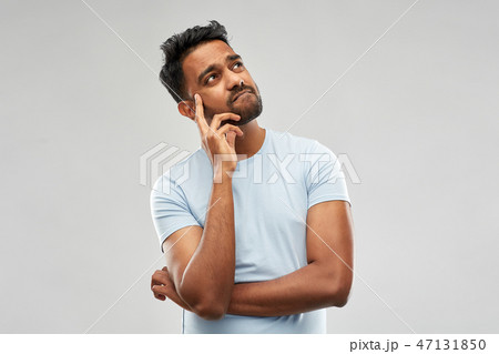 indian man thinking and looking up indian man thinking and looking up 47131850