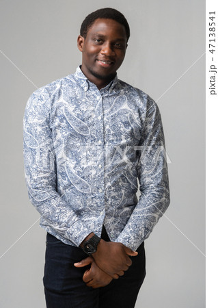 portrait of smiling dark-skinned young man isolated on white background 47138541