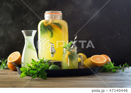 Lemonade with orange, lemon and mint in mason jar. Lemonade with orange, lemon and mint in mason jar. 47140446
