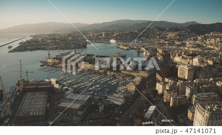 Aerial view of seaport and cityscape of Genoa in the evening, Italy Aerial view of seaport and cityscape of Genoa in the evening, Italy 47141071