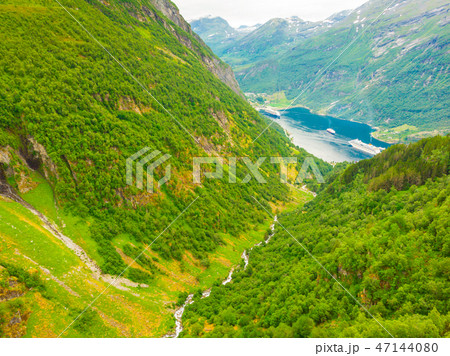 Fjord Geirangerfjord with ferry boat, Norway. Fjord Geirangerfjord with ferry boat, Norway. 47144080
