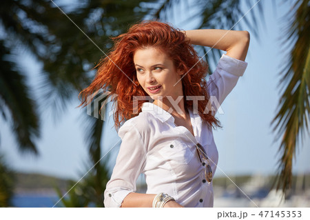 The woman tourist is visiting a small Croatian town Hvar. The woman tourist is visiting a small Croatian town Hvar. 47145353
