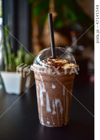Chocolate smoothie (milkshake) with jar in cafe 47145549