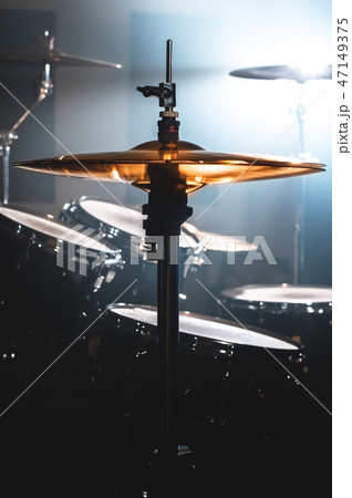 Close-up Drum set in a dark room against the backdrop of the spotlight. Atmospheric background 47149375