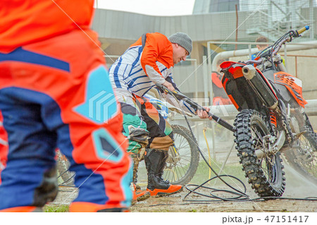 A man cleaning motorcycle - motorcycle detailing concept. Selective focus. 47151417