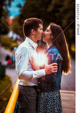 Young couple girl and man in the park Young couple girl and man in the park 47154459
