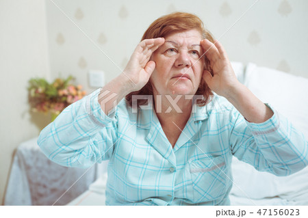 Elderly woman feeling sick in bed 47156023