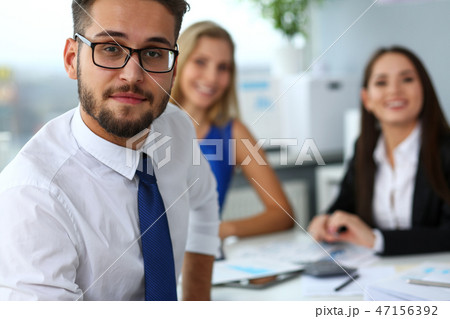 Handsome smiling bearded clerk man wearing glasses Handsome smiling bearded clerk man wearing glasses 47156392