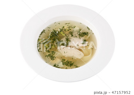 Chicken bouillon in deep round plate on white Chicken bouillon in deep round plate on white 47157952