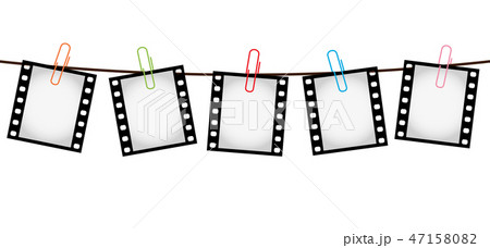 Five photo film slides on a rope with paperclips Five photo film slides on a rope with paperclips 47158082