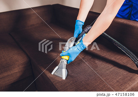 Sofa chemical cleaning with professionally extraction method. Upholstered furniture. Early spring Sofa chemical cleaning with professionally extraction method. Upholstered furniture. Early spring 47158106