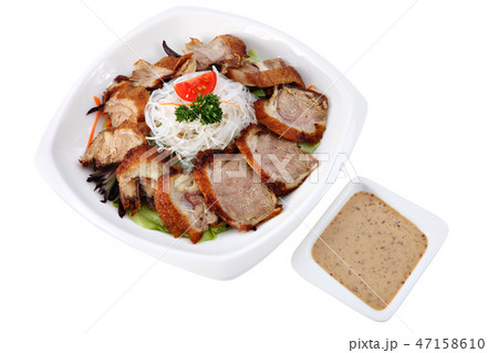 Slices roasted beijing duck  in a plate on white. 47158610