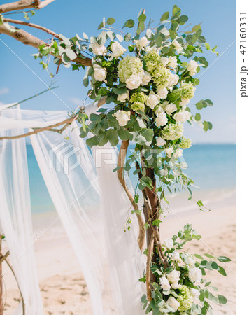 Details of wedding arch with white flowers at blue 47160331