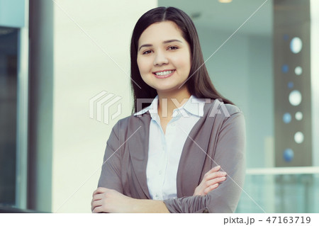 Attractive woman in office building Attractive woman in office building 47163719