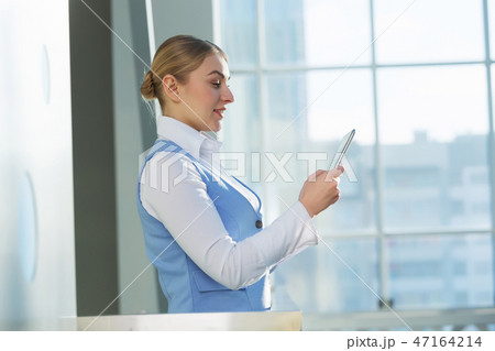 Attractive woman in office building 47164214