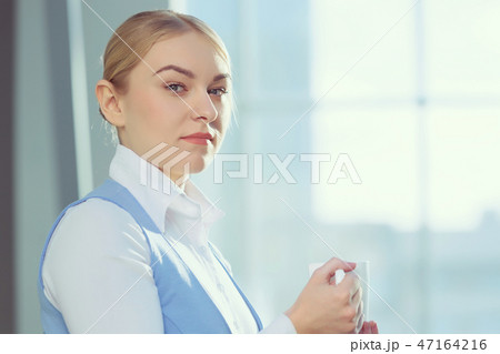 Attractive woman in office building 47164216