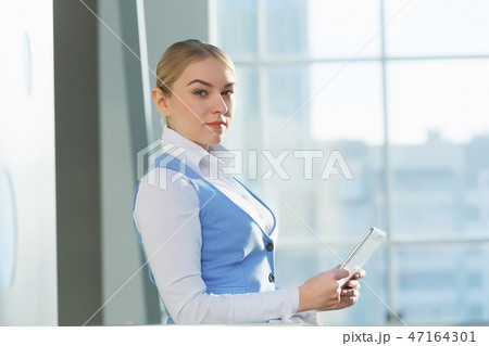 Attractive woman in office building 47164301