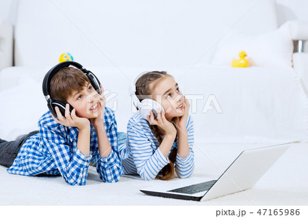 Cute kids using devices 47165986