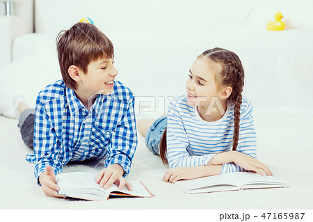 Cute kids reading books 47165987