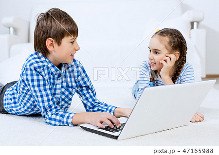 Cute kids using devices 47165988