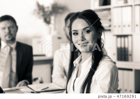 Beautiful smiling brunette clerk girl at workplace 47169291