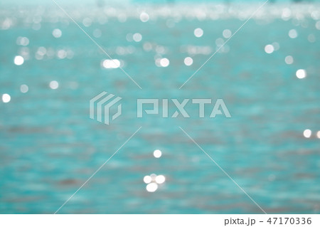 Blur reflection of sunlight on blue sea island 47170336