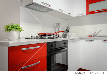 Modern red and white kitchen interior Modern red and white kitchen interior 47176301