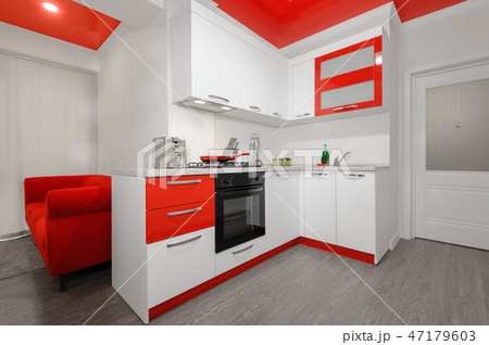 Modern red and white kitchen interior 47179603