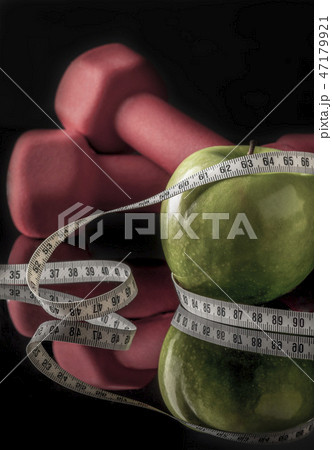 dumbbells and apple surrounded by measurement 47179921