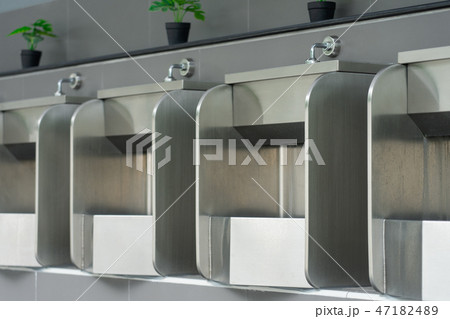 Public male bathroom is made of stainless steel Public male bathroom is made of stainless steel 47182489