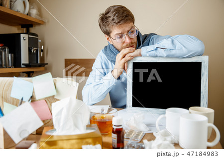 Sick man while working in office, businessman caught cold, seasonal flu. 47184983