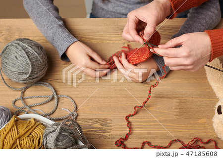 Child is learning to knit. Colorful wool yarns Child is learning to knit. Colorful wool yarns 47185608