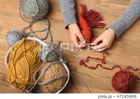Child is learning to knit. Colorful wool yarns Child is learning to knit. Colorful wool yarns 47185609