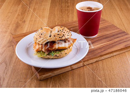 Sandwich on a plate with a cup of coffee 47186046