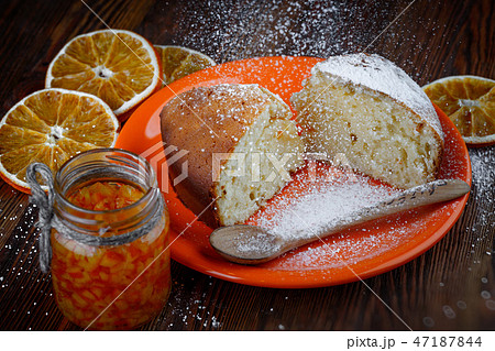 Slices of cake in a plate on a wooden table 47187844