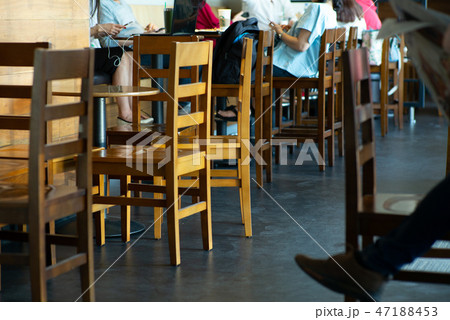Vintage wooden furniture with person reading 47188453