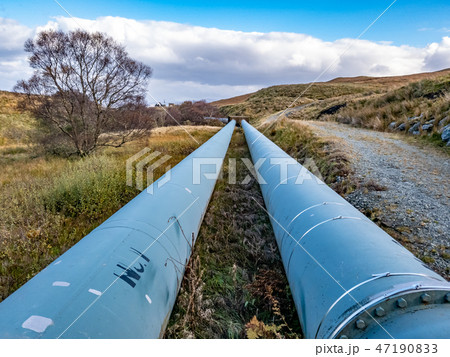 Pipeline of the Storr Lochs hydroelectric power station nestled under the mountains of the 47190833